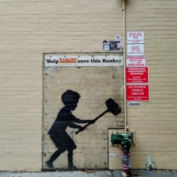 Banksy on Broadway Boy Hammering Hydrant 1B